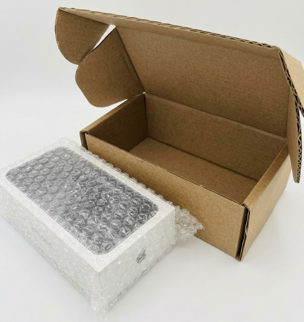 Mobile phone OEM box mailer set: an open brown postal box next to a boxed phone wrapped in bubble wrap