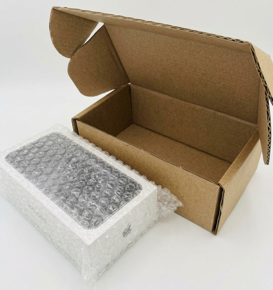 Mobile phone OEM box mailer set: an open brown postal box next to a boxed phone wrapped in bubble wrap